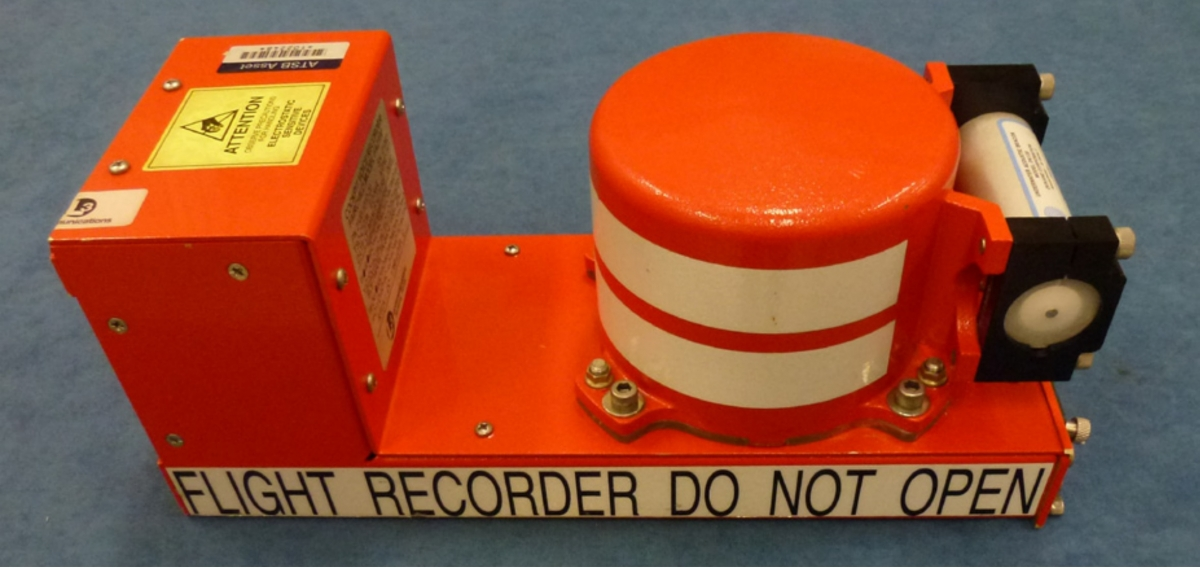 Aircraft cockpit voice recorder device with multiple audio channels, showing the robust orange casing designed to survive crashes